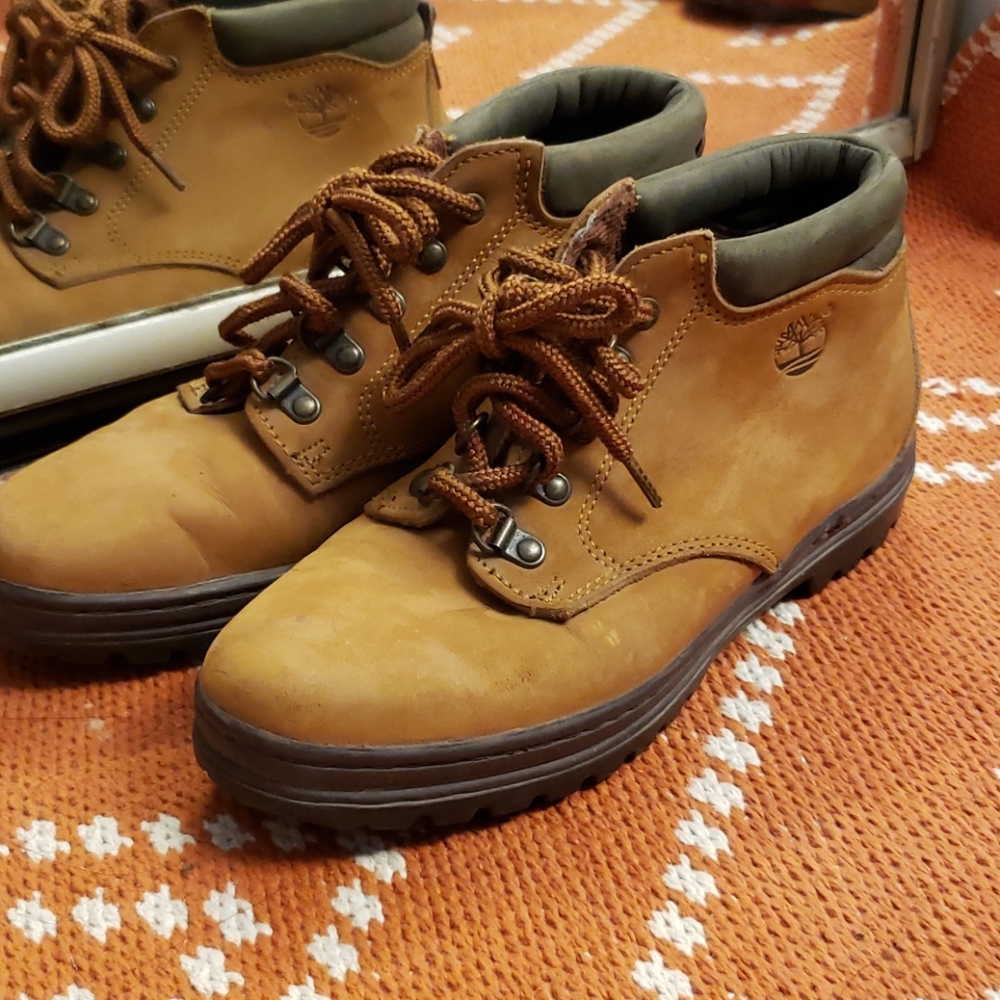 Tan and green Timberland boots